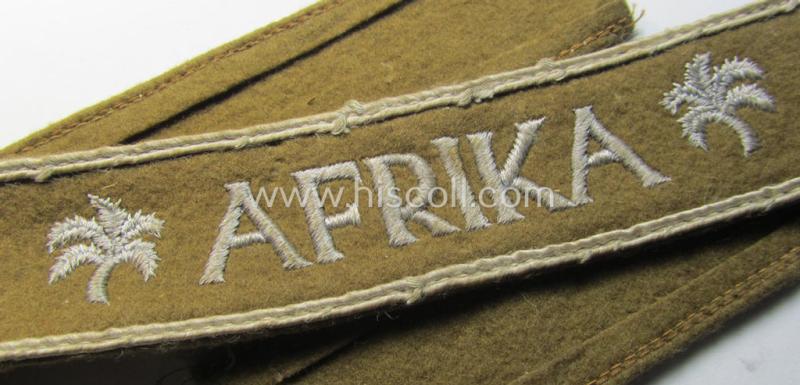 Attractive, WH (LW o. Heeres) cuff-title (ie. 'Ärmelstreifen') entitled: 'Afrika' (being a full-length example that comes in an issued-, used and/or carefully tunic-removed, condition)