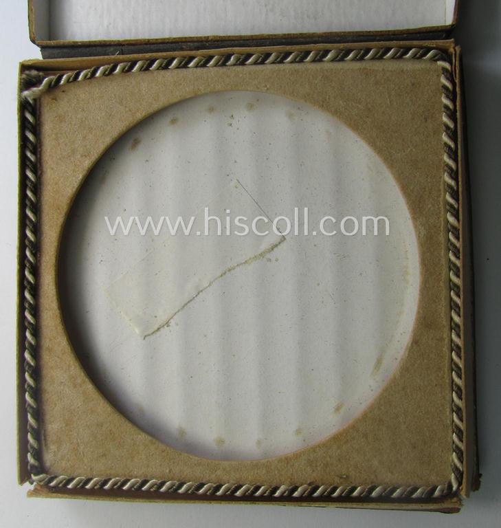 Regrettably damaged, earthenware (ie. 'Allach'-produced!): 'SS-Siegerplakette' as was issued during the: 'Sommer Sonnenwendwettkämpfen der SS' held in 1939 and that comes stored in its period, carton-based box as issued