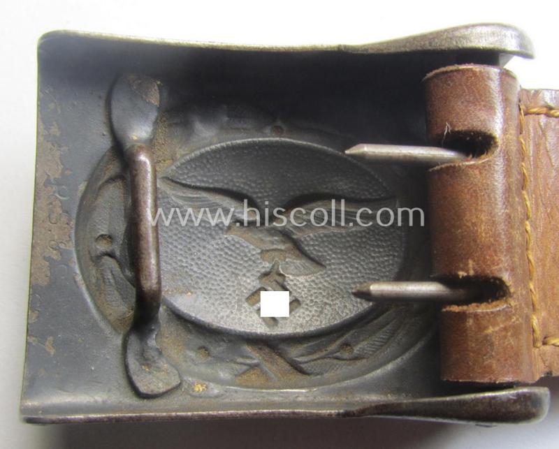 WH (Luftwaffe) bluish-grey-coloured, steel-based belt-buckle being a maker- (ie. 'R. Sieper & Söhne'-) marked example that comes mounted onto its leather-based tab