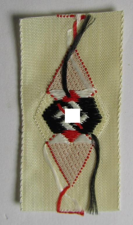 HJ (ie. 'Hitlerjugend') cap-badge (ie.: 'Raute') being a bright-red-coloured- and/or detailed example that is executed in the neat 'BeVo'-weave-pattern