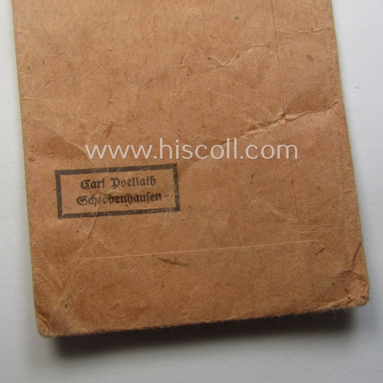Empty 'Zellstoff'-based pouch as was intended for a medal: 'Winterschlacht im Osten 1941/42' as was produced by the company: 'Carl Poellath - Schrobenhausen' (ie. 'Hersteller 84')