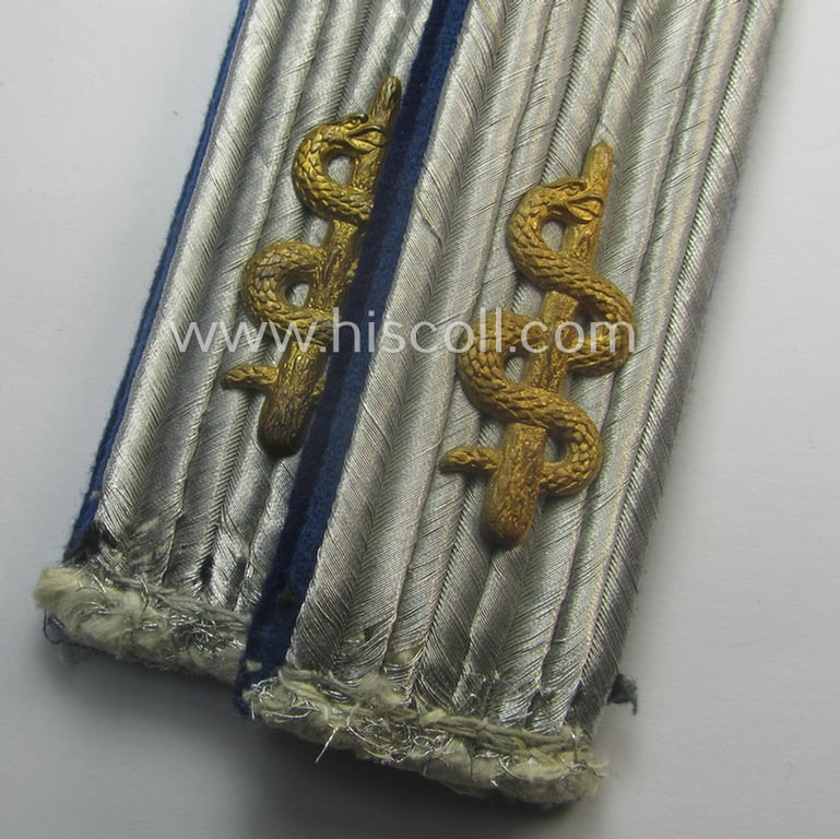 Pair of neatly 'cyphered', WH (Luftwaffe) officers'-pattern shoulderboards as piped in the darker-blue-toned branchcolour as was specifically intended for a: 'Leutnant der Reserve u. Arzt einer Sanitäts-Abtlgs.'