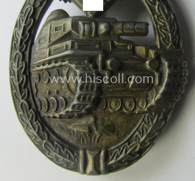 'Panzerkampfabzeichen in Bronze' (or: bronze-class panzer assault badge or PAB) being a neat (I deem) somewhat later-war-period zinc- (ie. 'Feinzink'-) version as was procuced by the: 'Frank u. Reif'-company