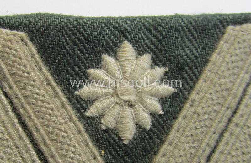 WH (Heeres) 'Armwinkel' (or: arm-chevron) as executed on typical field-grey-coloured (and HBT-type!) linnen as was specifically intended for usage by a soldier with the (unusually encountered!) rank of: 'Stabsgefreiter'