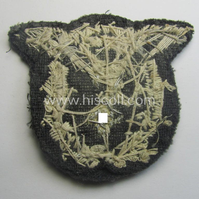 Partly damaged WH (Luftwaffe) 'Flugzeugführerabzeichen in Stoff' or: pilots'-badge) being a detailed, hand-embroidered example that comes in a truly worn- ie. carefully tunic-removed-, condition