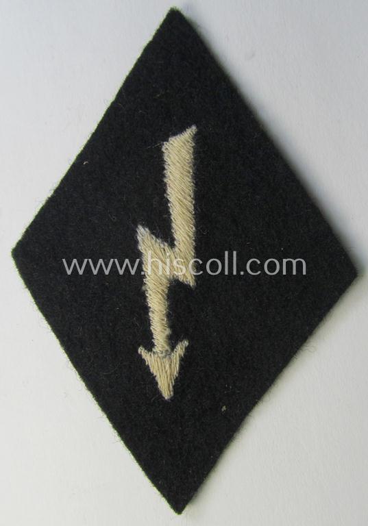 Waffen-SS-pattern, machine-embroidered and black-coloured sleeve-insignia (ie. 'Ärmelraute') depicting a so-called: 'Signalblitz' as was used and intended to signify membership within a: 'Waffen-SS Nachrichten'-unit