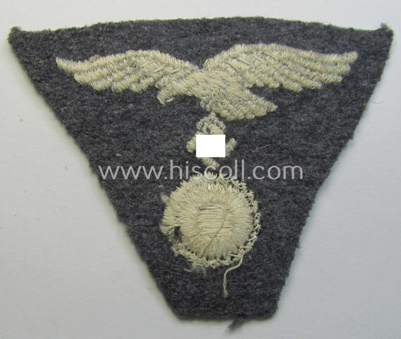 Attractive - and scarcely encountered! - WH (Luftwaffe) so-called: 'M43-pattern'-cap-trapezoid (being a machine-embroidered and 'virtually mint' example that is executed on a bluish-grey-coloured- and/or woolen-based background)