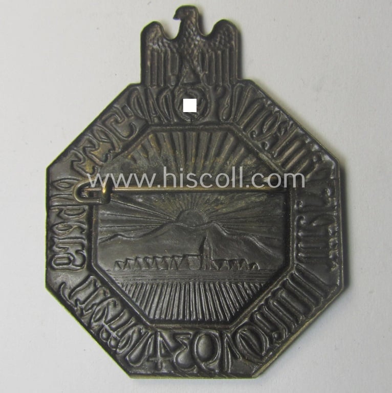 Commemorative, bronze-toned, N.S.D.A.P.-related 'tinnie' being a non-maker-marked example depicting a landscape and sunrise with above a: 'Reichadler'-device surrounded by the text: 'Hesselberg Treffen - Gau Mittelfranken - 1934'