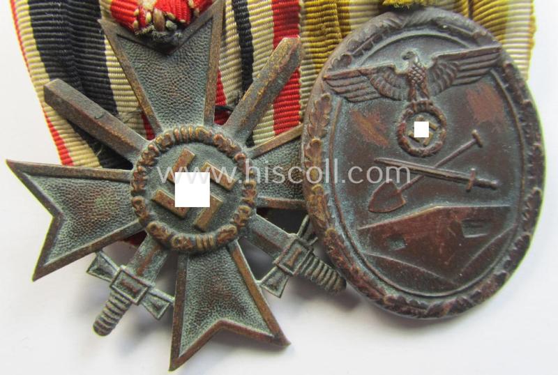 Neat - and clearly used! - two-pieced medal-bar (ie. 'Ordenspange') showing resp. a: 'Kriegsverdienstkreuz 2. Klasse mit Schwn.' and a: 'Westwall'-medal that come period-mounted as a: 'Doppelspange'