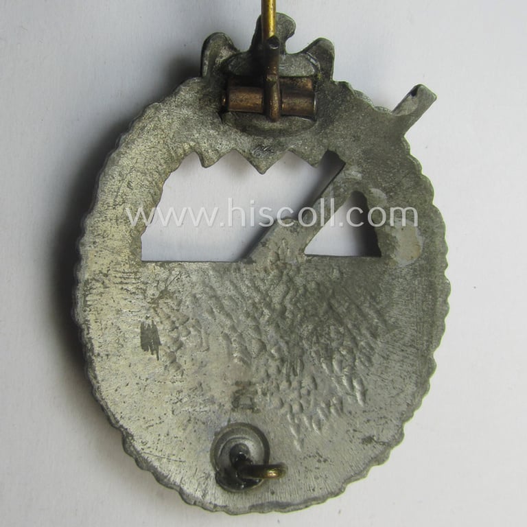 WH (KM) 'Marine-Artillerie-Abzeichen' being a maker- (ie. 'H.A.'-) marked- and/or typical zinc- (ie. 'Feinzink'-) based example by the: 'Hermann Aurich'-company