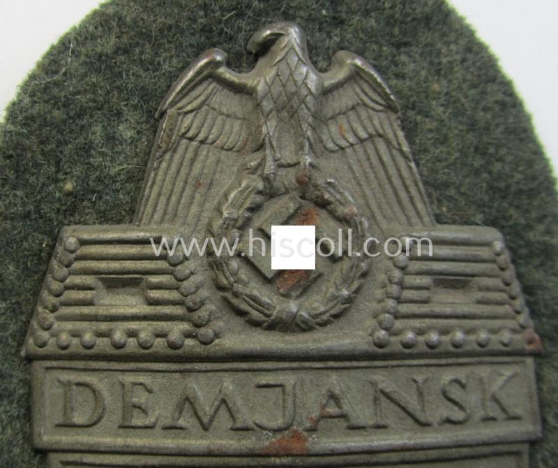 WH (Heeres ie. Waffen-SS) 'Demjansk'-campaign-shield as executed in typical magnetic metal (ie. so-called: 'Eisenblech') and that comes in an overall very nice- ie. fully untouched, condition