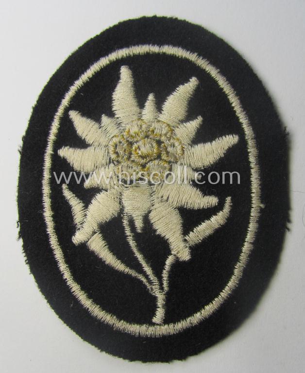 Waffen-SS-pattern, black-coloured sleeve-insignia (ie. 'Ärmelabzeichen') depicting an: 'Edelweiss'-flower as used by the various 'Gebirgsjäger'- (ie. mountain-troops-) related divisional-staff