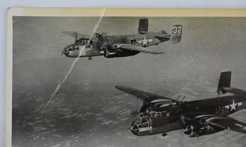 US WW2 Press Photo 'Flak damaged Bomber'