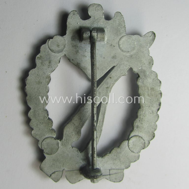 WH (Heeres- ie. Waffen-SS) 'Infanterie-Sturmabzeichen in Silber' (or: silver-class infantry assault-badge ie. IAB) being a maker- (ie. '2'- ie. 'Assmann') marked so-called: 'molded-pattern'-example as executed in zinc-based metal