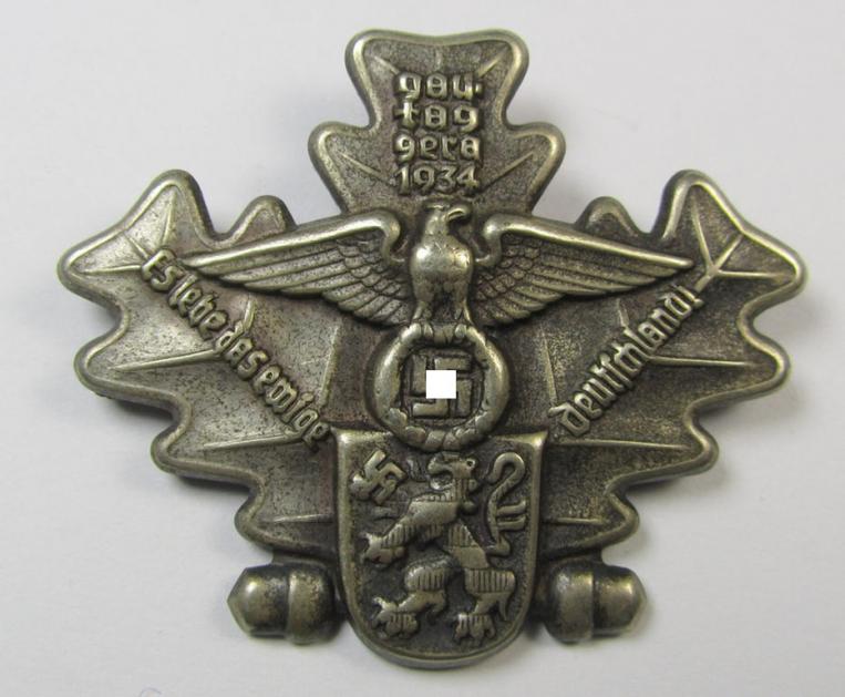 Commemorative, 'Buntmetall'-based- and/or: silver-coloured N.S.D.A.P.-related 'tinnie' being a non-maker marked example depicting a detailed eagle-device resting on a shield surrounded by the text: 'Gautag Gera 1934 - Es lebe das ewige Deutschla...