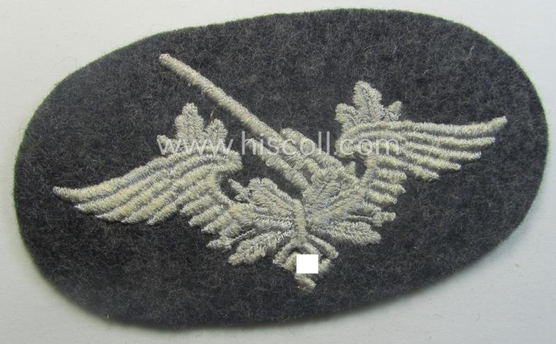 Machine-embroidered WH (Luftwaffe) trade- ie. special-career-patch as was intended for: 'Flak-Artillerie'-staffmembers and that comes in a probably issued but never worn- (ie. 'virtually mint'-), condition