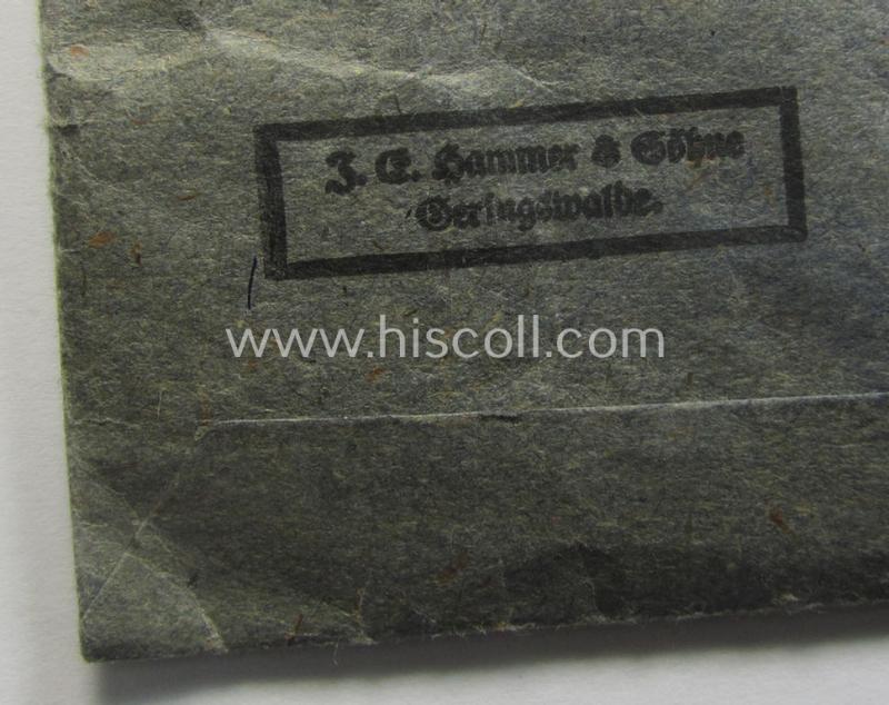'Eisernes Kreuz 2. Kl.' being a maker- (ie. '55'-) marked example that comes stored in its period 'Zellstoff'-based pouch by the: 'J.E. Hammer & Söhne'-company as was based in the town of Geringswalde