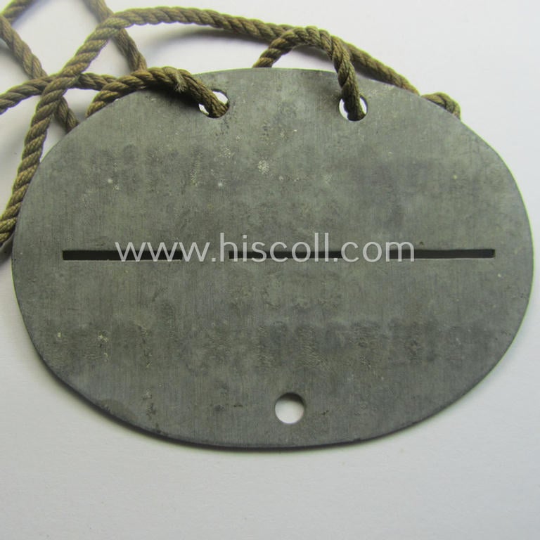 Zinc-based, WH (Heeres) 'Gebirgsjäger-Pioniere'-related ID-disc bearing the clearly stamped unit-designation that reads: 'Stamm. Geb.Pi. E.u.A. Btl. 82' and that comes as issued and/or worn