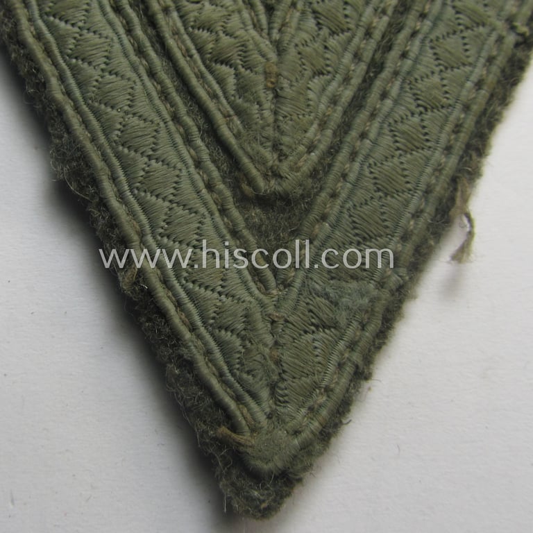 WH (Heeres) 'Armwinkel' (or: arm-chevron) as executed on typical field-grey-coloured wool as was specifically intended for usage by a soldier with the rank of: 'Obergefreiter'