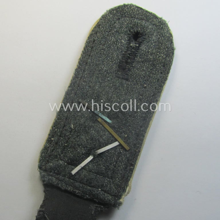 Single, Waffen-SS NCO-type and neatly 'cyphered' shoulderstrap as piped in the white-coloured branchcolour as was intended for usage by an: 'SS-Oberscharführer' who served within the: SS-Rgt. 'Deutschland' (2. SS-Pz-Div. "Das Reich")