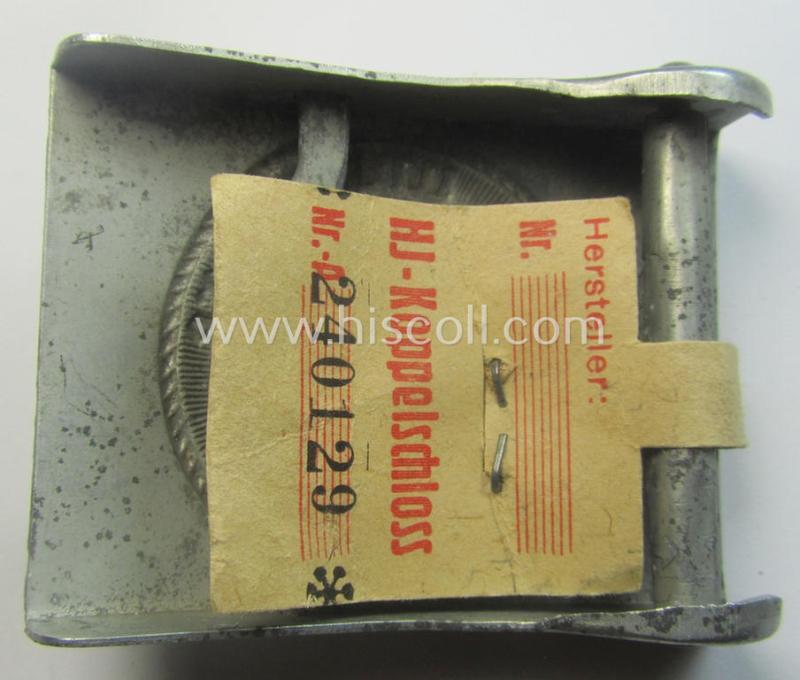 HJ ('Hitlerjugend'), zinc-based belt-buckle being a 'virtually mint' and/or non-maker-marked example having a seldomly seen 'cranked-catch'-set-up and that comes with its period 'RzM'-etiket still attached