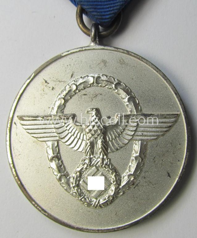 Attractive, bright-silver-toned so-called: 'Polizei-Dienstauszeichnung der 3. Stufe' (or: police loyal service medal of the 3rd class as was awarded for 8 years of service) that comes mounted on its period ribbon (ie. 'Bandabschnitt') as issued