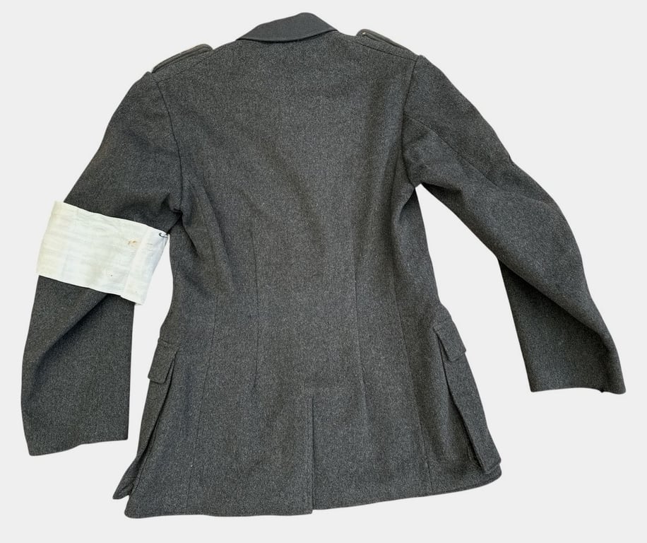 DRK (Deutsches Rotes Kreuz)  Vorhelfer service tunic with original insignia and armband.