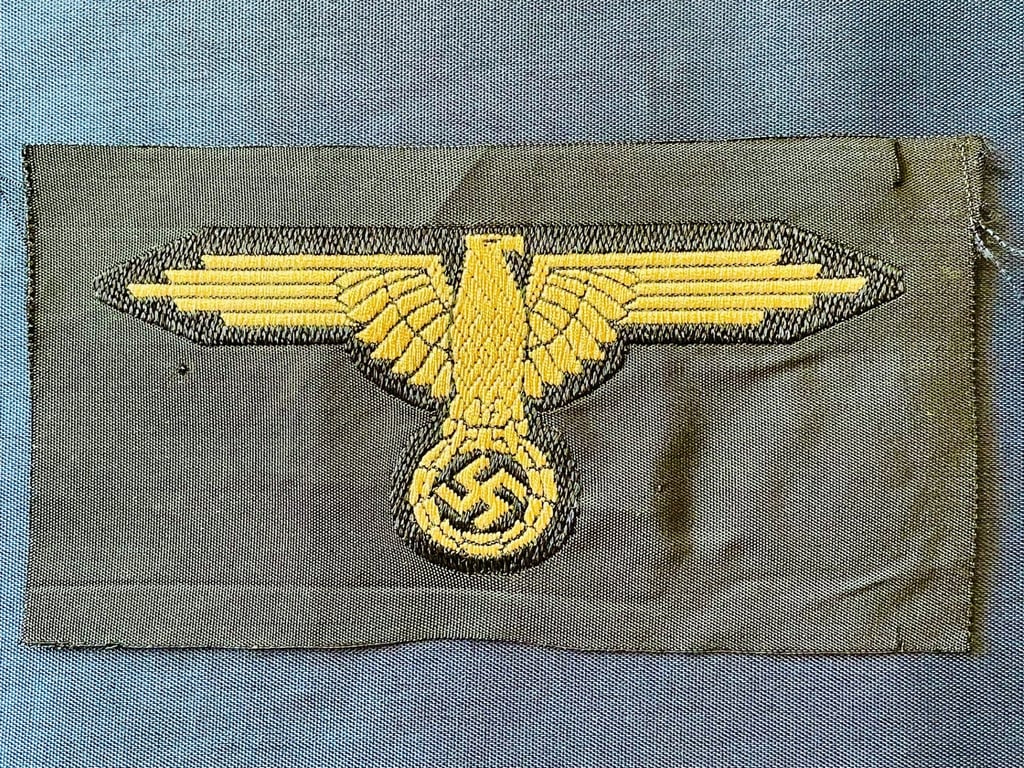 WWII GERMAN WAFFEN SS ARM EAGLE WITH SS PAPER ISSUED RZM TAG REMAINING.