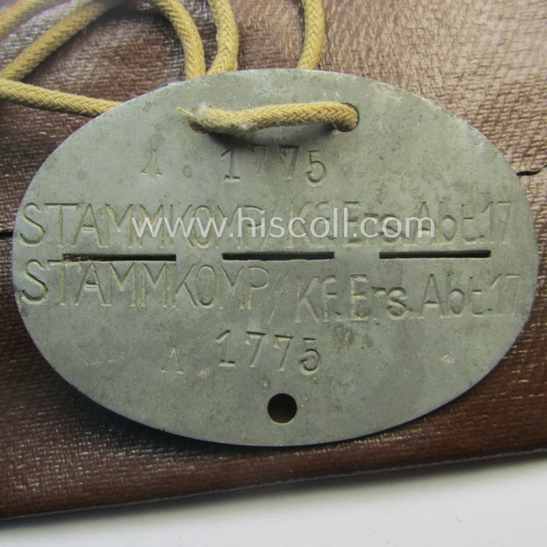 Zinc-based, WH (Heeres-) transport (ie. 'Nachshub'-) related ID-disc bearing the clearly stamped unit-designation: 'Stammkomp/Kf.Ers.Abt. 17' and that comes stored in its period-pouch as issued and/or worn