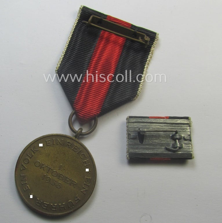 WH Czech-occupation- (ie. 'Anschluss'-) medal: '1. Oktober 1938' that came with its single-pieced ribbon-bar (ie. 'Feld- o. Bandspange') as issued and/or recently found