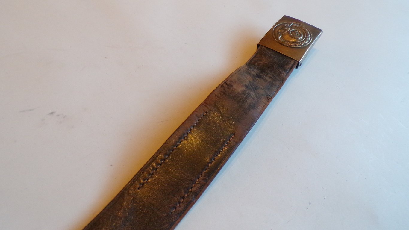 S.A brown leather belt and buckle