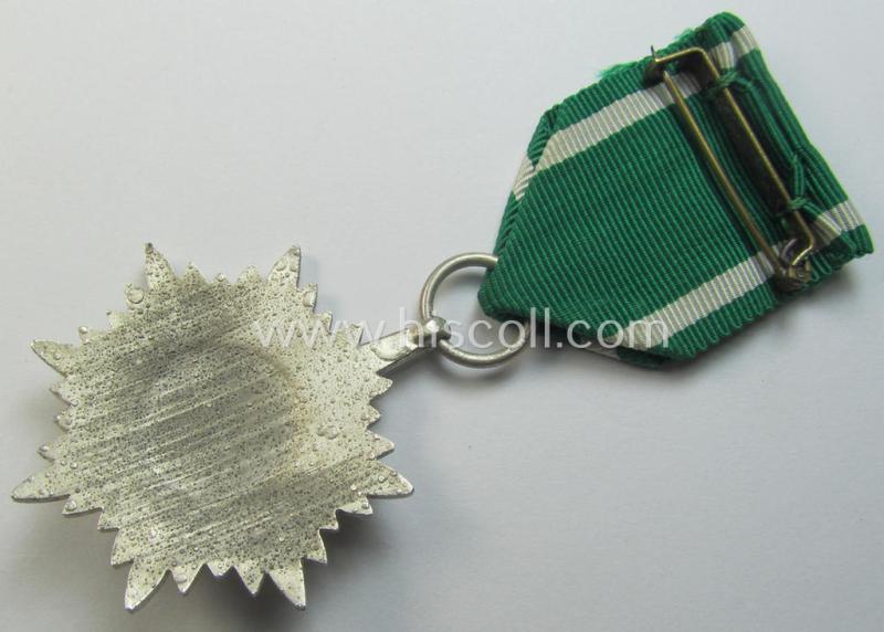 Superb, WH-related: 'Verdienstsauszeichnung für Angehörige der Ostvölker, 2. Kl. in Silber ohne Schwertern' being a maker- (ie. '100'-) marked example that comes stored in its period 'Zellstoff'-based pouch