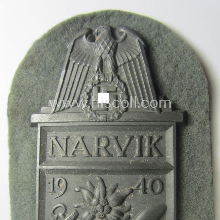 'Virtually mint' - and fully complete! - example of a WH (Heeres) 'Narvik'-campaign-shield as executed in typical: 'Feinzink' (as was presumably produced by the: 'Wilhelm Deumer'-company)