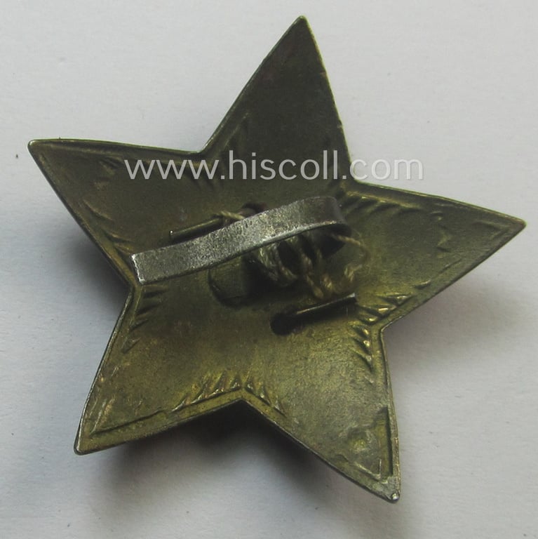 Unusual item that originated from a German soldier: a Russian, larger-sized and/or WWII-period, enamelled star-shaped cap-badge showing the communist logo on a bright-red-coloured surface