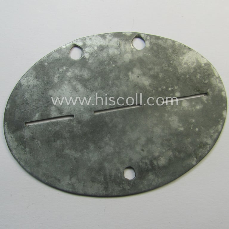 Zinc-based, WH (Heeres) 'Infanterie'- (ie. 'Maschinengewehre'-) related ID-disc bearing the clearly (dual!) stamped unit-designation that simply reads: 'Inf.Ers.Btl. I./462 / 4.MG.Ers.Komp.' and that comes as issued and/or worn