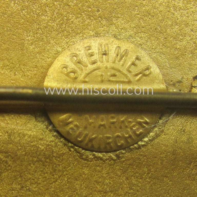 Commemorative, N.S.F.K.-related brooch (ie. 'Brosche') being a maker- (ie. 'Brehmer'-) marked example depicting the N.S.K.K.-logo (ie. 'fliegender Mensch') and text: 'N.S.F.K. - Reichswettberwerb für Motorflugmodelle - 1938'