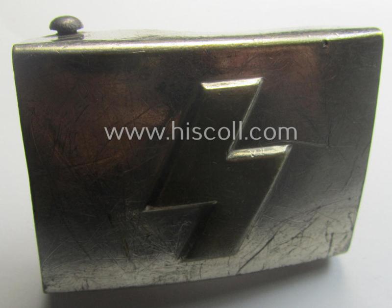Complete(!) DJ (ie. 'Deutsches Jungvolk') silver-coloured- (ie. typical nickle-chromed) belt-buckle (ie. 'Koppelschloss') being a maker- (ie. 'RzM U.E. 72'-) marked example that comes mounted onto its (nicely marked), leather-based belt