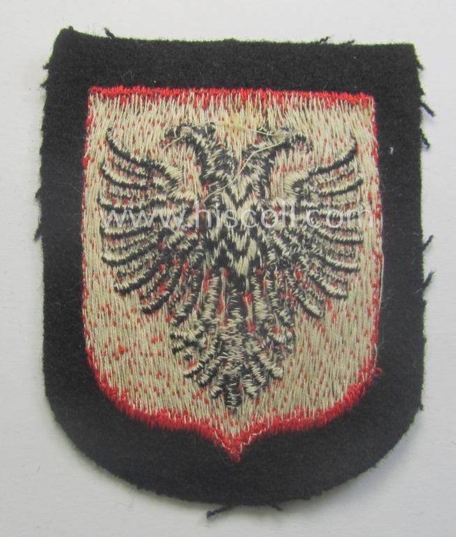 Albanian, Waffen-SS 'volunteer' arm-shield as was specifically intended for usage by soldiers of the: '21. Waffen-Grenadier-Division der SS' (ie. 'Skanderbeg' or: 'albanische Nr. 1') that comes in a 'virtually mint- ie. unissued', condition
