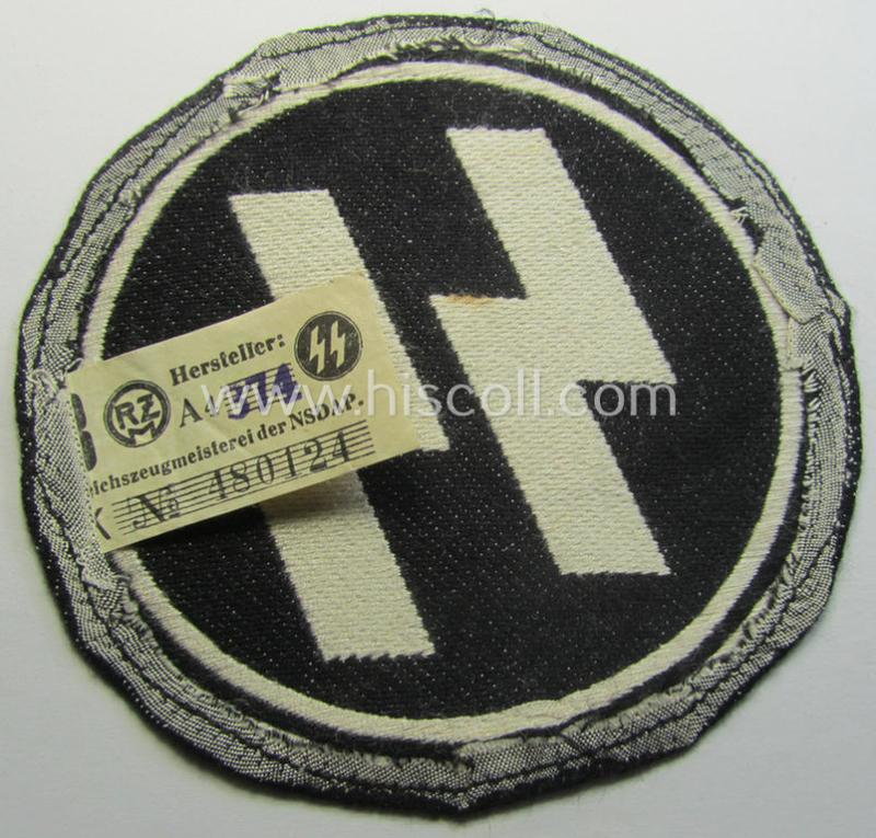 Waffen-SS sport-shirt emblem as executed in the neat 'BeVo'-weave pattern that still retains its period-attached 'RzM'-etiket and that comes in an overall very nice- (ie. 'virtually mint'-), condition