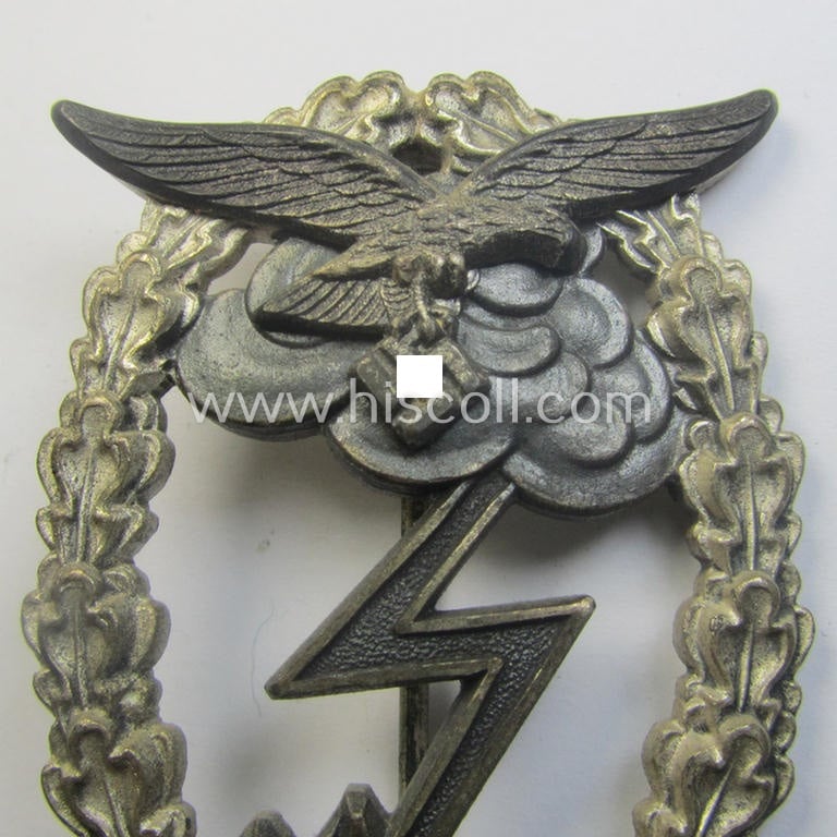Mid- (ie. later-) war-period, zinc- (ie.'Feinzink'-) based version of a WH (Luftwaffe) 'Erdkampfabzeichen' (being a maker-marked example by the 'G.H. Osang'-company having a silvered- and 'riveted' eagle-device attached)