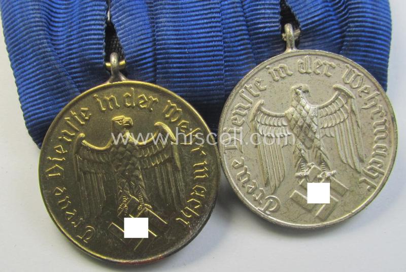 Superb, two-pieced medal-bar (ie. 'Spange') showing two: WH (Luftwaffe) so-called: 'Dienstauszeichnungen für 4 u. 12 Jahre Treue Dienste' that both come period-mounted as a so-called: 'Doppelspange'