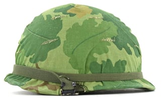 US Vietnam War Infantry helmet with camouflage cover...