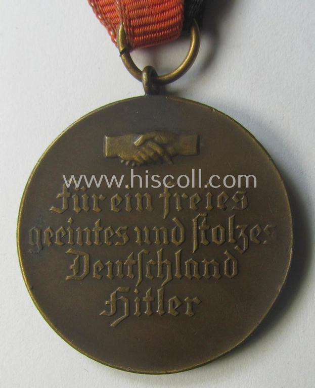 Darker-bronze-toned commemorative-medal (ie. 'Erinnerungs-Medaille') entitled: 'Hindenburg - Hitler - 30.1.1933 - 5.3.1933' and that comes mounted onto its period ribbon showing an interwoven swastika-device