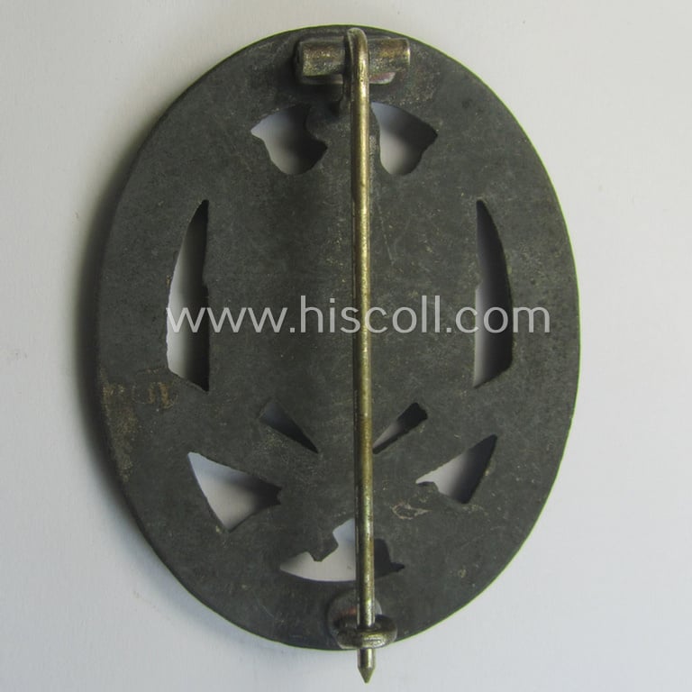 'Allgemeines Sturmabzeichen' (or: General Assault Badge ie. GAB) being a typical unmarked, zinc-based- (ie. 'Feinzink'-) and/or: 'flat-back'-version as was (I deem) produced by the: 'Rudolf Karneth'-company