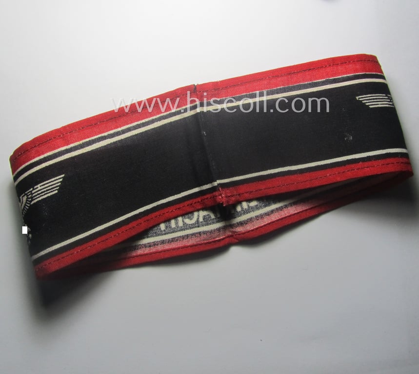 Typically printed- and/or later-war-period, bright-red- and/or black-coloured so-called: 'Deutscher Volkssturm'-armband (ie. 'Armbinde') that comes in an overall very nice- (I deem hardly used- nor worn- ie. 'virtually mint'-), condition