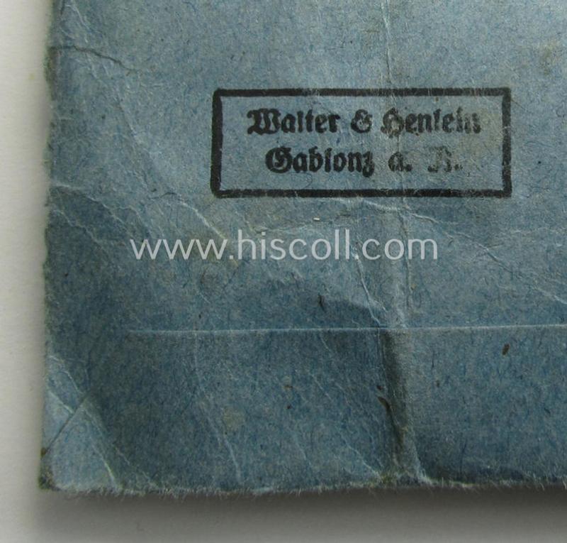 'Eisernes Kreuz II. Klasse' being a non-maker-marked example by the maker (ie. 'Hersteller'): 'Walter & Henlein' that comes stored in its period, 'Zellstoff'-based pouch