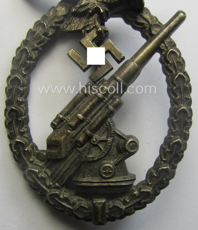 WH (Luftwaffe) 'Flakkampfabzeichen' being a detailed 'Buntmetall'-based and (unusually seen!) non-maker-marked example as was produced by the: 'C.E. Juncker'-company and that comes as moderately worn