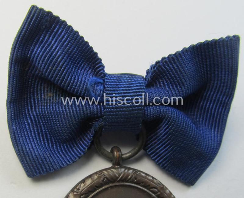 Superb example of a: 'Reichsarbeitsdienst der weiblichen Jugend' (or: RADwJ) so-called: 'Dienstauszeichnung 4. Stufe in Bronze' that comes mounted onto its period-attached ('bow-tie'-shaped!) ribbon (ie. 'Bandabschnitt')