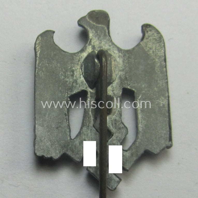 Greyish-silver-toned- (and: 'Feinzink'-based) WH (Heeres) so-called: 'Zivilabzeichen' (or: army civil-attire badge) being a detailed (albeit non-maker-marked) example that comes mounted onto its longer-sized pin