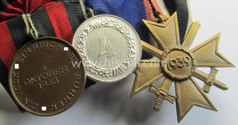 Three-pieced medal-bar (ie. 'Ordenspange') respectively depicting a: 'KvK II. Klasse m. Schw.', a: WH (Heeres o. KM) so-called: 'Dienstauszeichnung für 4 Jahre Treue Dienste' and a: Czech 'Anschluss'-medal: '1 Oktober 1938'